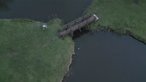 Ducks-near-mini-bridge,-Bourg,-Bordeaux,-France---aerial