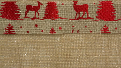 falling snow with christmas textile reindeer