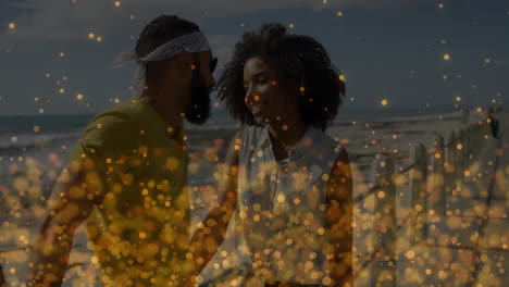 walking on beach, couple with golden sparkles animation overlay, looking relaxed