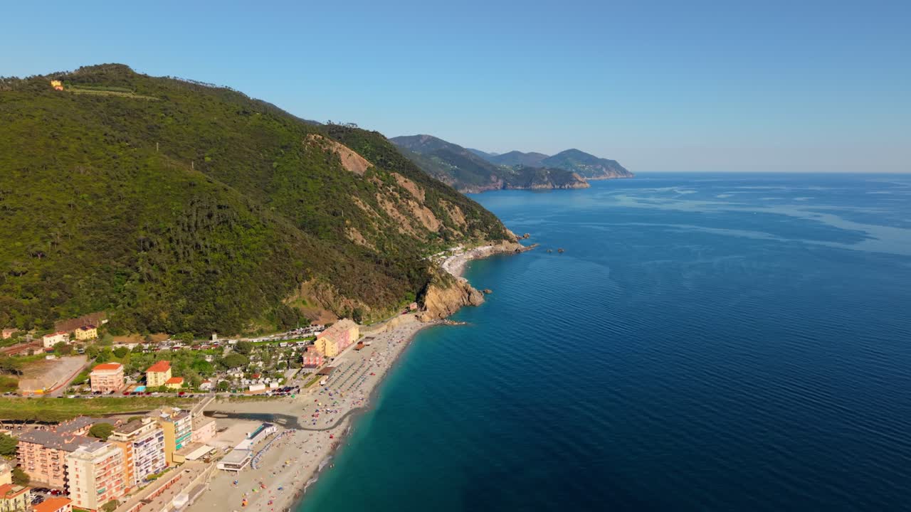 Beautiful coastal view of Italy with clear blue sea and lush green hills