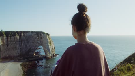 woman looking at a scenic coastal view