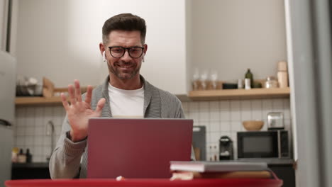 man starting online conference at home