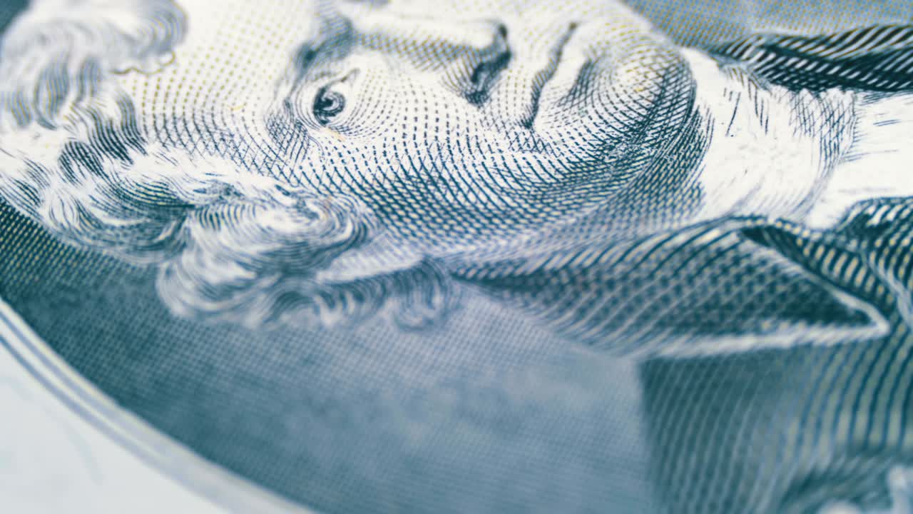 천천히 회전하는 토마스 제퍼슨의 얼굴 2달러 지폐