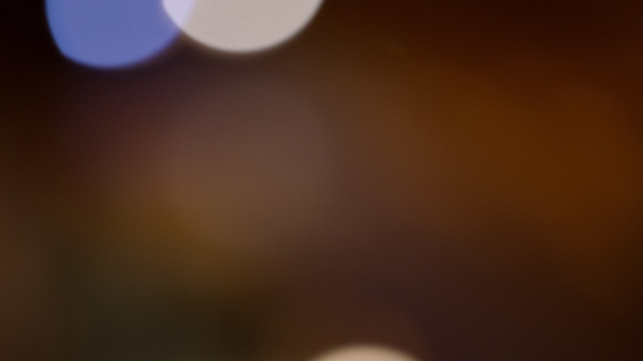 Traffic Colorful Defocused Bokeh Of Cars Driving By And City Lights At Night