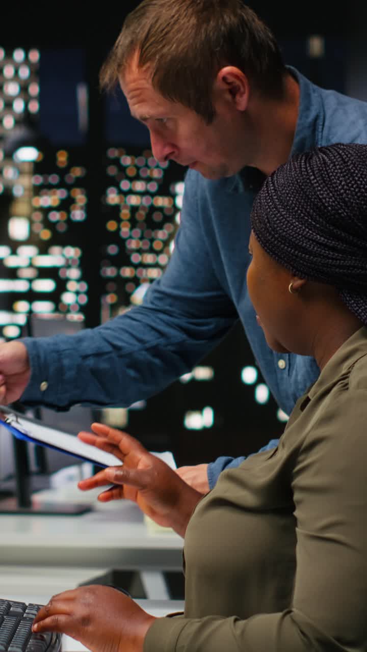 Vertical Video Man and woman filmmakers editing video shoot in post production