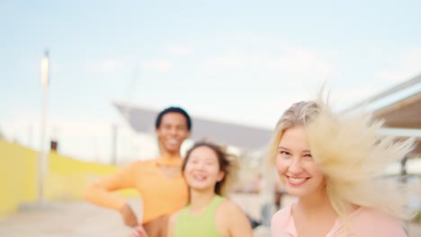 spontaneous friends of different ethnicities happily strolling by the sea