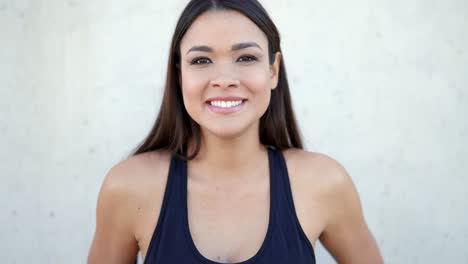 smiling woman in sports bra