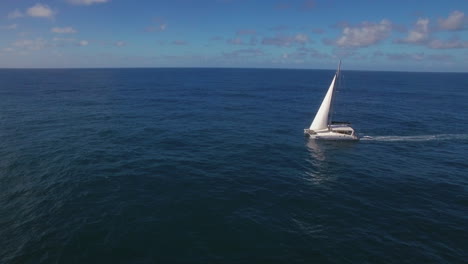 aerial view of ocean skyline and sailing yacht