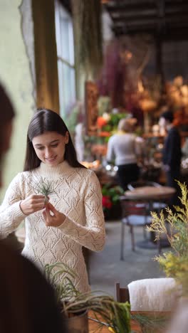 woman creating floral arrangements