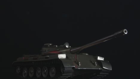 close up of metal toy tank in the dark-1