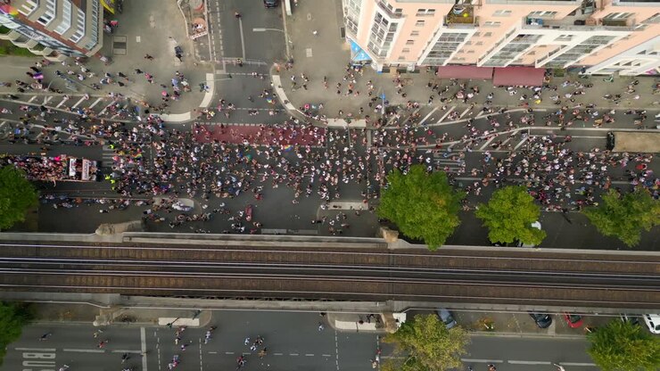 Nice aerial top view flight CSD Pride Love Parade 2023 in city Berlin Germany Summer day