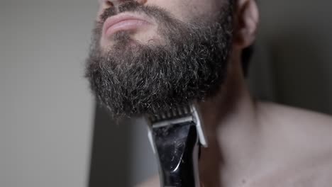 male grooming routine: thick beard trim in slow motion