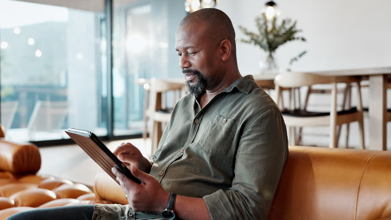 Man using tablet at home