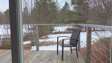 wild deer near private home in canada, snowy landscape