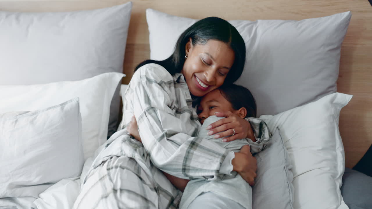 Bed, hug and mother with child with parent love
