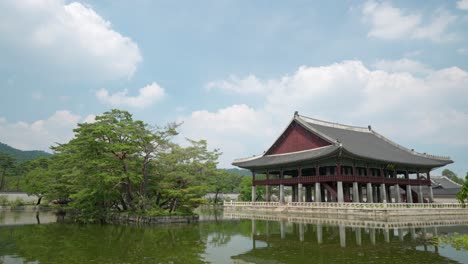 Gyeonghoeru-Pavilion-of-Korean-architecture-taken-on-summer-against-white-fluffy-clouds-with-copy-space