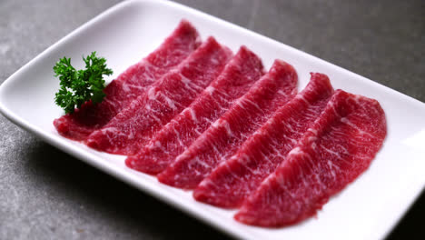 fresh beef raw sliced with marbled texture served for sukiyaki and shabu or yakiniku