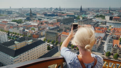 A-Woman-Takes-A-View-From-Above-The-City-Of-Copenhagen-In-Denmark
