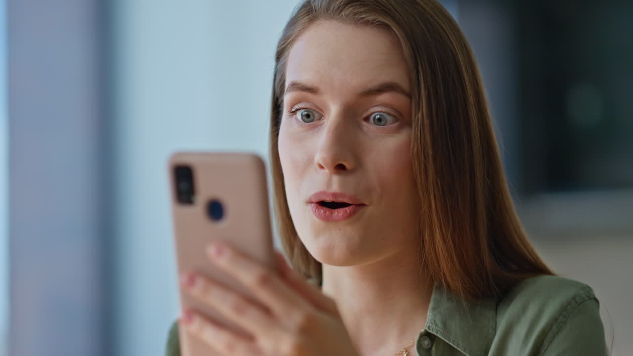 Woman shopping online smartphone choosing purchases closeup. Smiling brunette