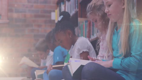 animación de un sendero de luz sobre diversos escolares leyendo libros en la biblioteca