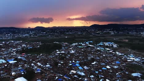 The-Jahi-District-of-Abuja,-Nigeria-during-a-golden-sunset---aerial-flyover