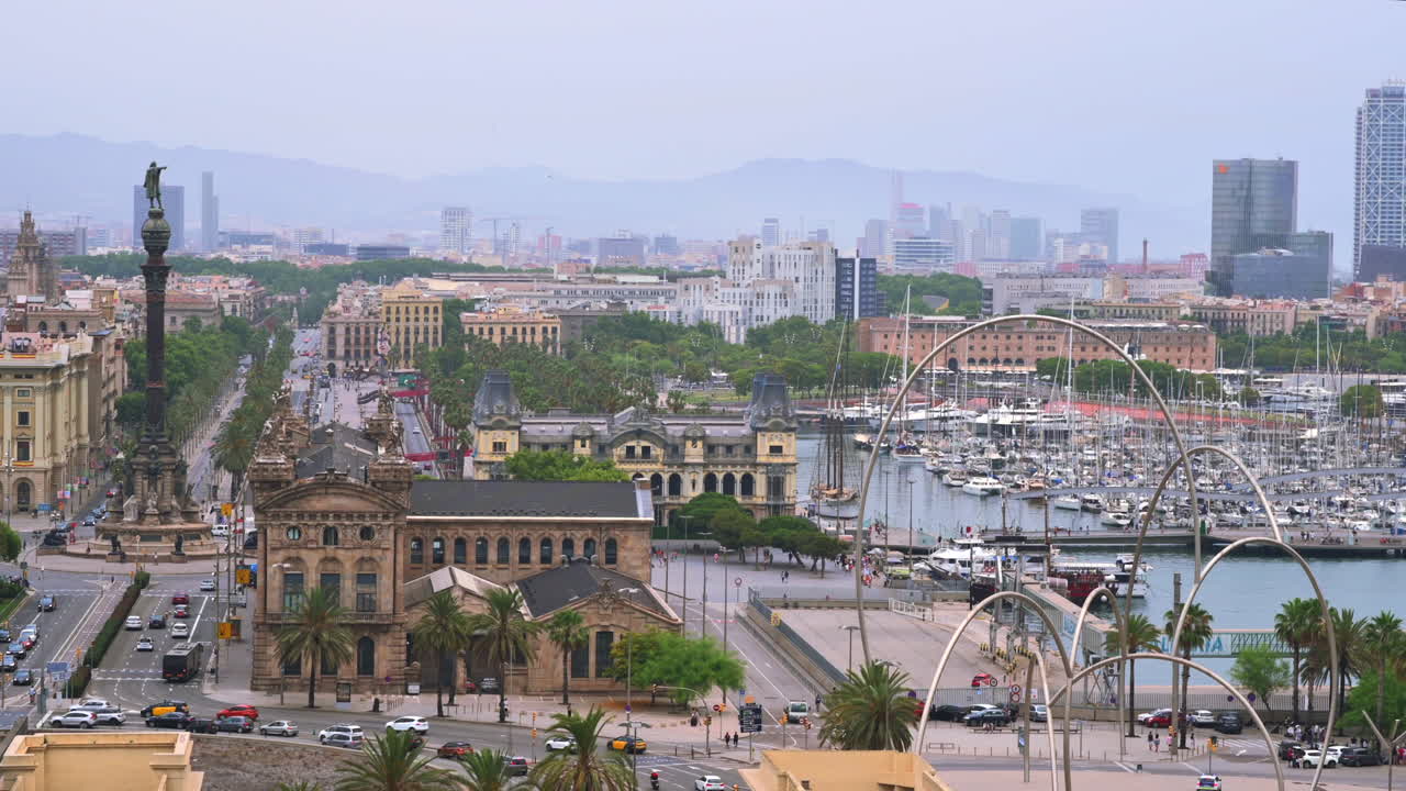 Aerial drone view of the Port Vell, the Columbus Monument and the Junta d'Obres del Port building in Barcelona, Spain