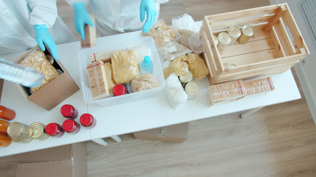 Volunteers Sorting and Packing Food Donations