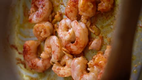 cooking shrimps with garlic and spanish paprika