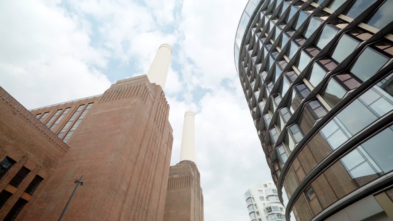 Historic landmark Battersea Power Station next to modern glass building in London