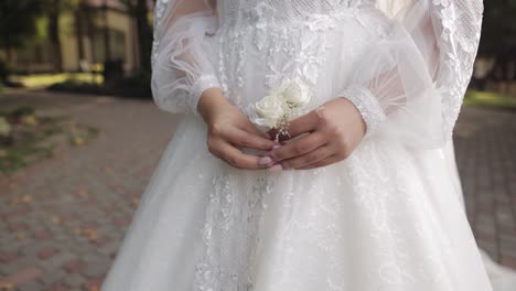 bride holding a bouquet of white flowers