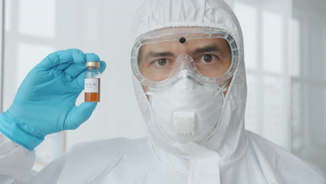 Scientist holding COVID-19 Vaccine Vial