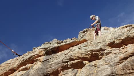 mountaineer adjusting the rope 4k