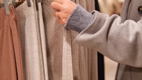 woman shopping for clothes in a clothing store