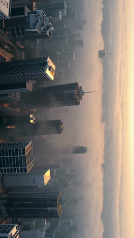 sunrise over a foggy city skyline