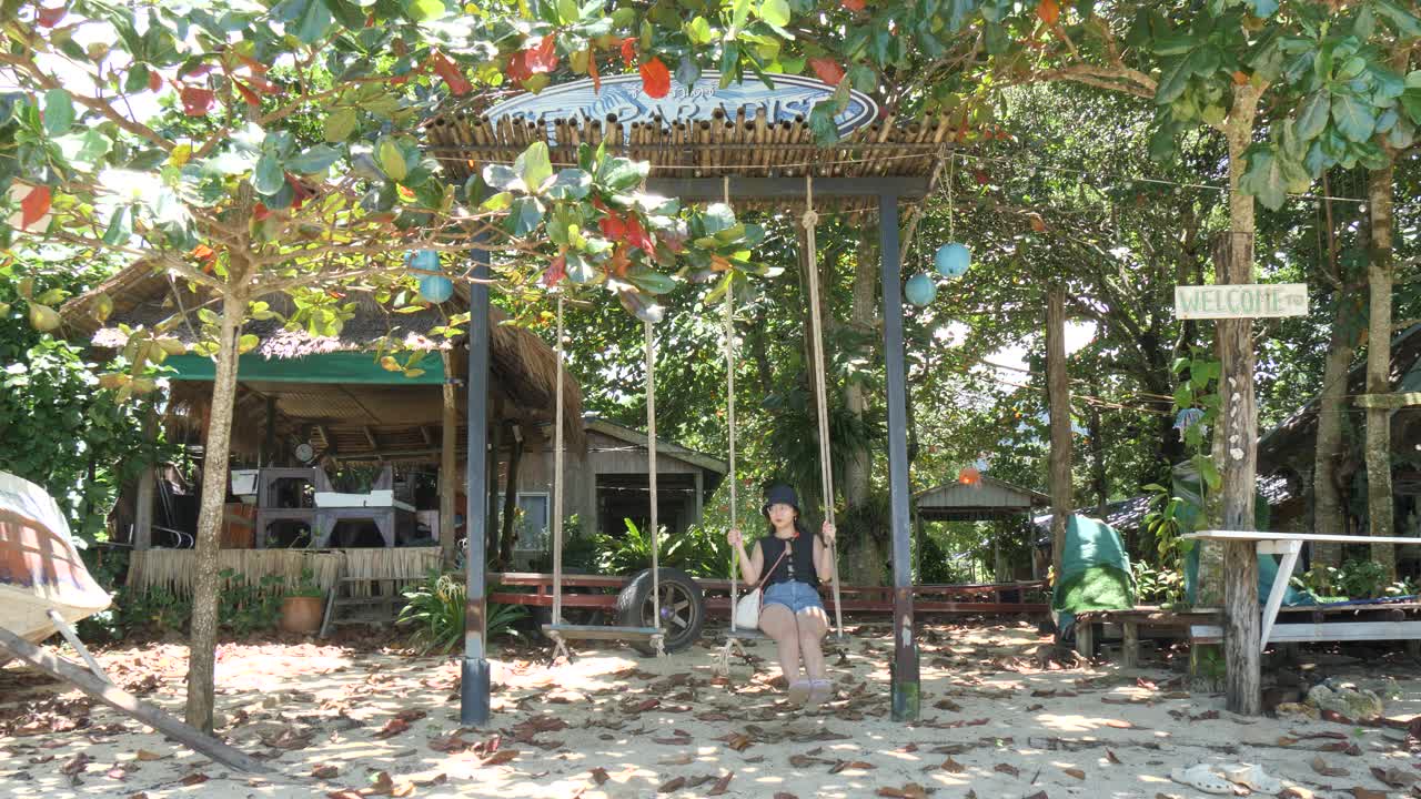 Peaceful swing by Klong Kloi Beach in sunny Ko Chang, Thailand vibe