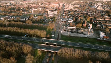 aerial view of dutch city with highway overpass