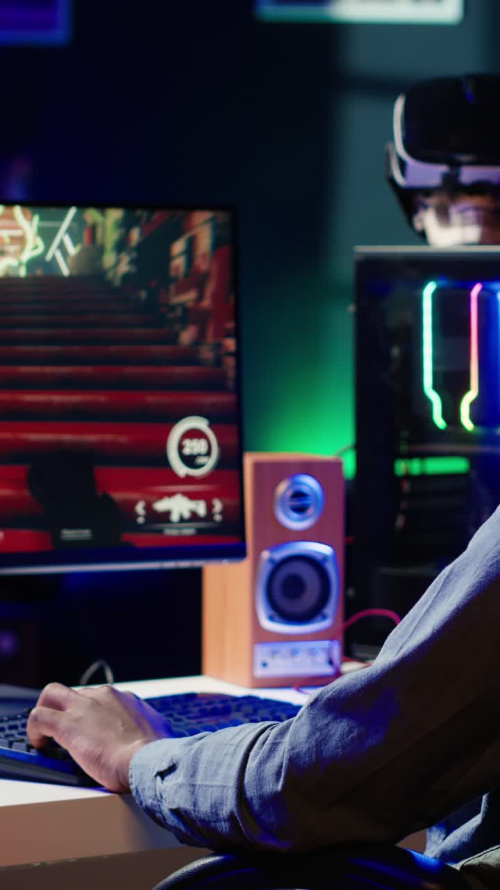 Vertical video Man having fun by playing videogames on gaming PC at computer desk