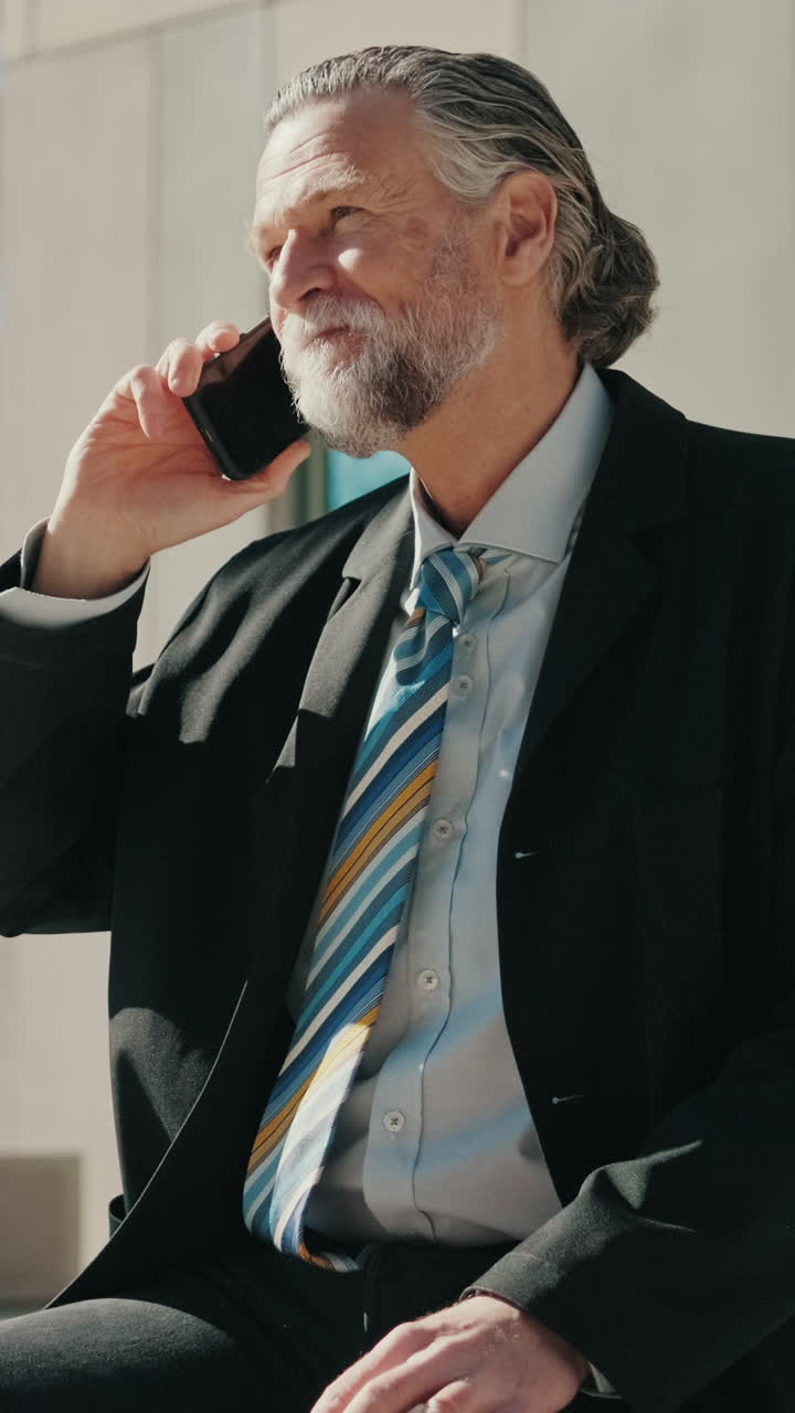 Businessman on Phone Outside Building