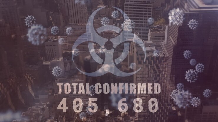Covid-19 animation shows rising cases and virus cells over a city.