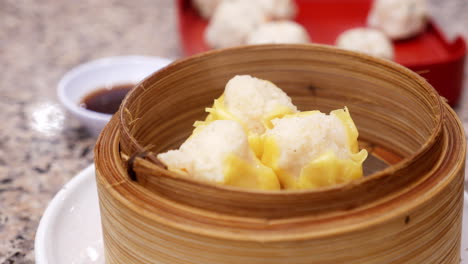 thai steamed dumplings gently cooked in bamboo steamer served in a plate