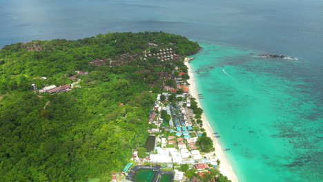 Cinematic-flyover-of-houses-and-hotels-on-the-famous-Koh-Phi-Phi-in-Thailand-Asia,-Aerial