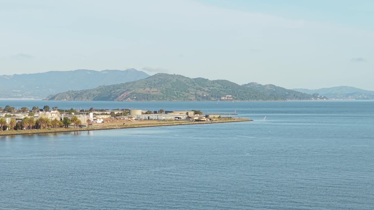 Overhead view shows the island’s gridlike layout contrasted with the organic curve of surrounding water.