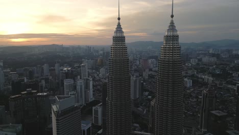 sunset aerial view of petronas twin towers in kuala lumpur, malaysia