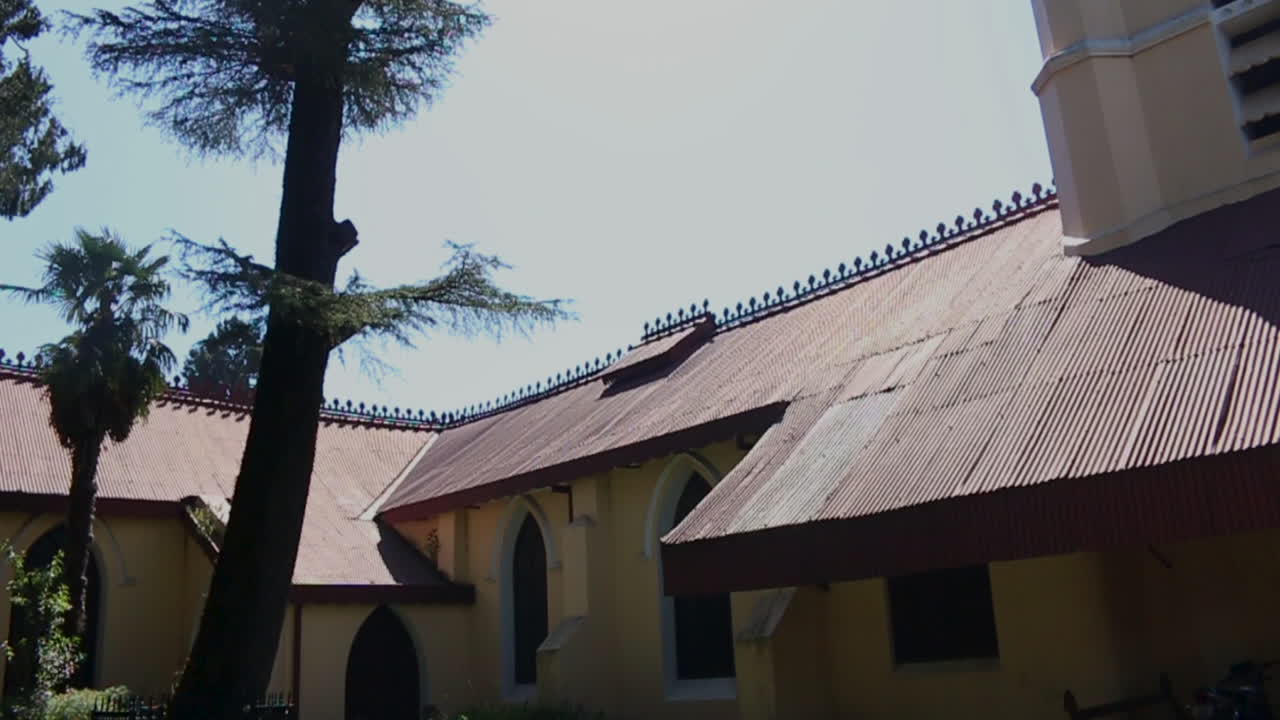 Oldest Christian church in the Himalayas, St Mary's, located above Mall Road in Mussoorie, slow motion outdoor pan shot.