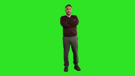 full length studio portrait of mature male teacher or businessman standing against green screen