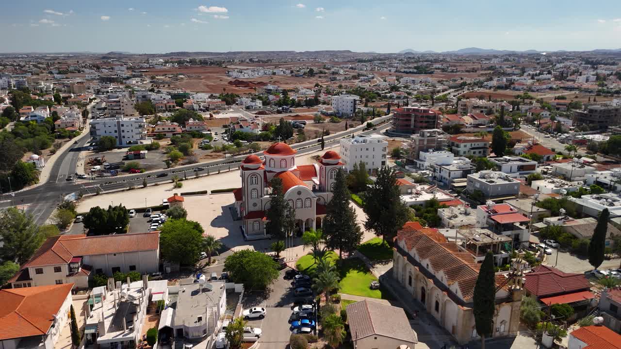 Explore stunning angles of a historic church surrounded by greenery and cityscape in Cyprus. This captivating location is perfect for appreciating architectural beauty and local culture