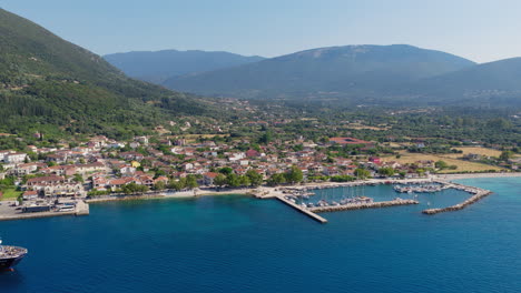 aerial view of sami town and marina surrounded by ionian landscapes in kefalonia island, greek luxury tourism
