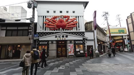 pedestrians exploring a vibrant japanese shopping street