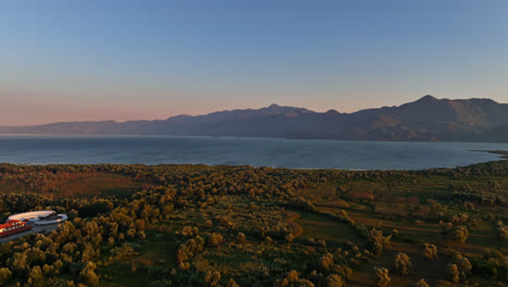 Aerial-view-circling-over-wetlands-at-Skadar-lake,-summer-sunset-in-Montenegro