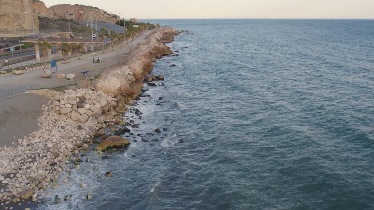 Drone flyover of rocky coast shoreline